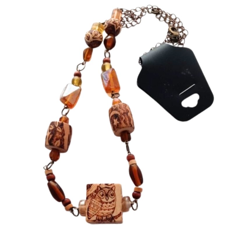 Woodburned beads necklace with owl theme.